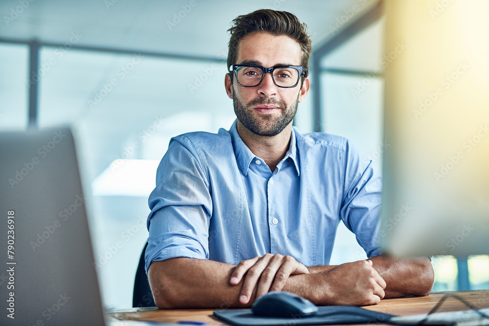 Computer, employee and man in office, portrait and smile for copywriter, startup and workplace of business. Happiness, staff and person with technology, desktop and glasses with confidence and pride Computer, employee and man in office, portrait and smile for copywriter, startup and workplace of business. Happiness, staff and person with technology, desktop and glasses with confidence and pride