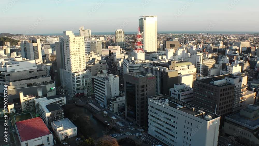 SHIZUOKA, JAPAN - MARCH 2024 : Aerial high angle view of cityscape of Shizuoka city in sunset. View of street around downtown area. Time lapse shot, dusk to night. SHIZUOKA, JAPAN - MARCH 2024 : Aerial high angle view of cityscape of Shizuoka city in sunset. View of street around downtown area. Time lapse shot, dusk to night.