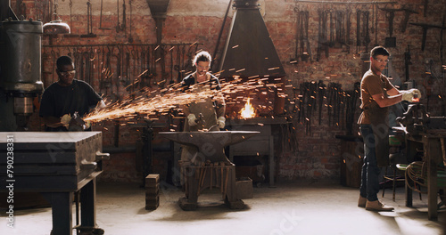 Foto Blacksmith, male team and sparks from metal, flame and equipment for professional craft