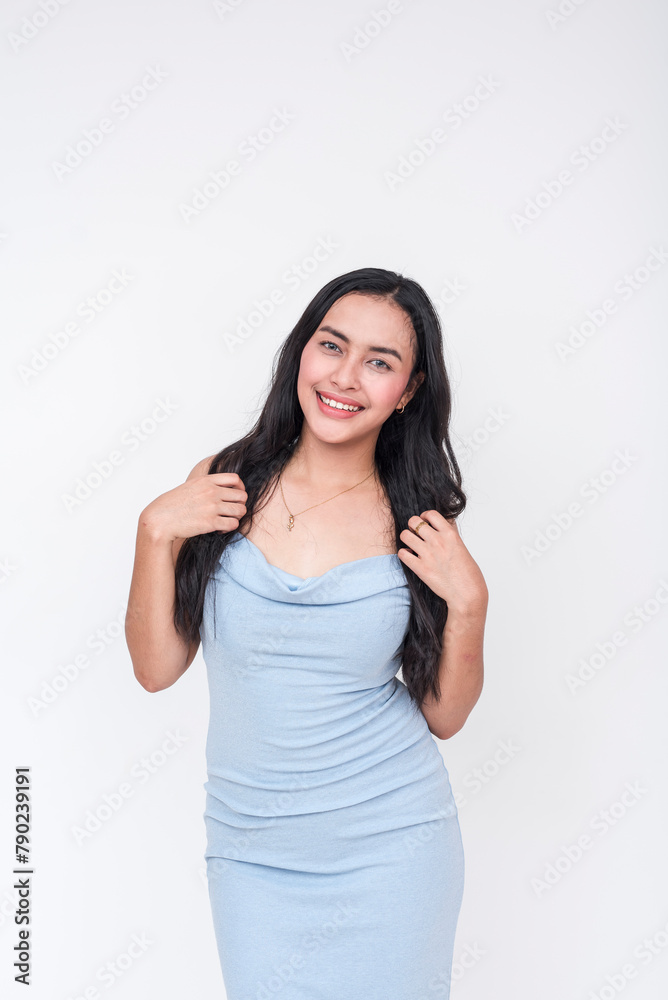 Charming young woman in elegant baby blue dress on a white background Charming young woman in elegant baby blue dress on a white background