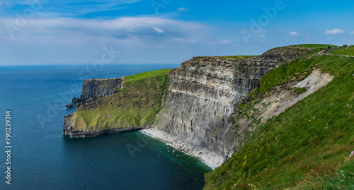 The Cliffs of Moher are sea cliffs located at the southwestern edge of the Burren region in County Clare, Ireland