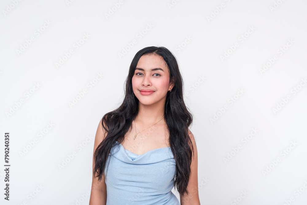 Young woman in a baby blue dress smiling, isolated on white background Young woman in a baby blue dress smiling, isolated on white background