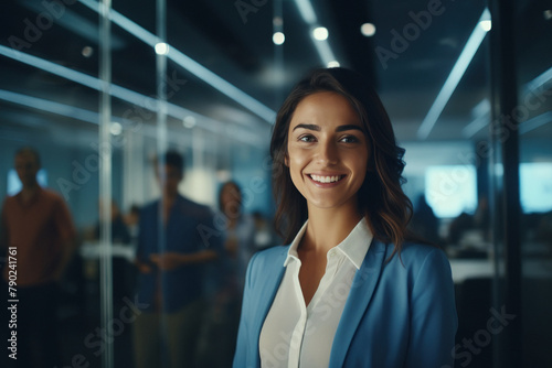 Young indian businesswoman or entrepreneur smiling at office © Neha