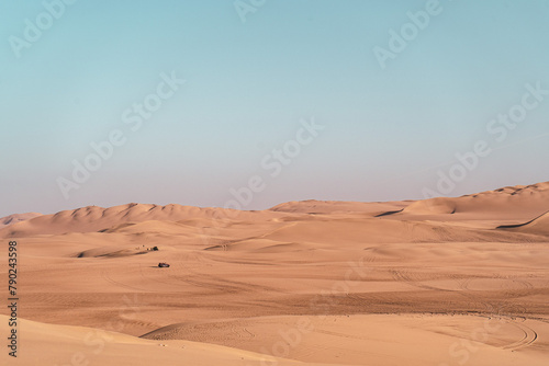 sand dunes in the desert at sunset