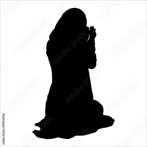 Silhouette of a Muslimah praying