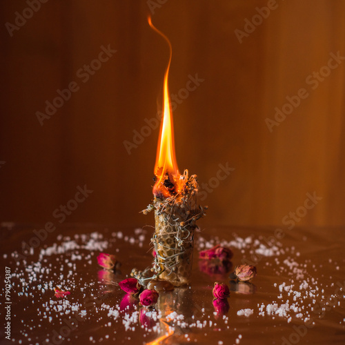Heal and mental calmness. Cleansing aura and burning negative energy from human. Wax candle with herbs on altar
