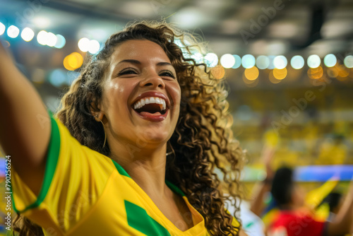 Brazilian football soccer fans in a stadium supporting the national team, Seleção
 photo