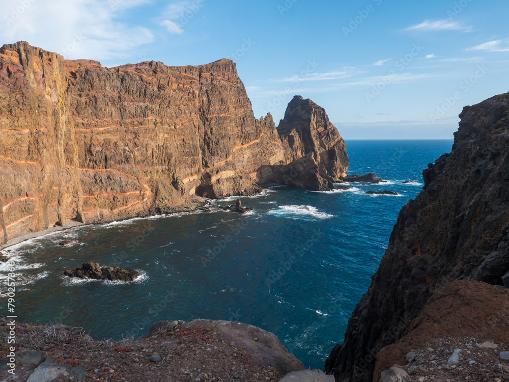 Cape Ponta de Sao Lourenco, Canical, East coast of Madeira Island, Portugal. Scenic volcanic landscape of Atlantic Ocean, rocks and cllifs and cloudy sunrise sky. Views from popular hiking trail PR8