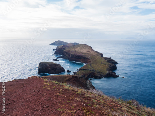 Island Ilheu da Cevada and Ilheu do Farol, seen from Ponta de Sao Lourenco, Canical, East coast of Madeira Island, Portugal. Scenic volcanic landscape of Atlantic Ocean, rocks and cllifs and sky