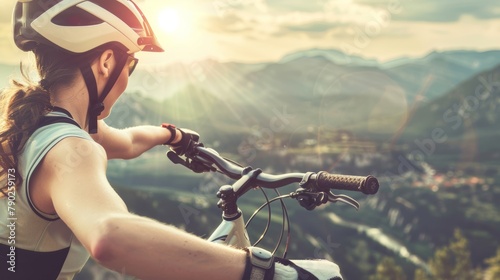 Female cyclist with helmet enjoying mountain valley view. Adventure travel and outdoor activity concept. Design for poster, banner, and sports promotion.