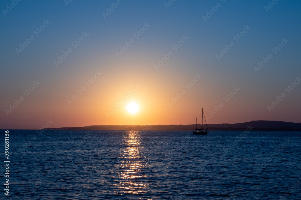 Yacht at anchor  at Calaforte, Sant Antioco, Sardinia, at sunset