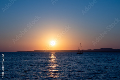 Yacht at anchor at Calaforte, Sant Antioco, Sardinia, at sunset