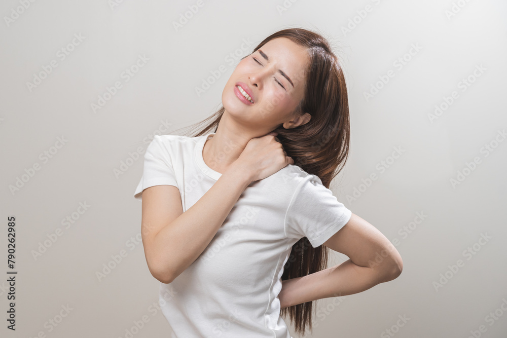 Pain body muscles stiff problem, asian young woman, girl painful with back, neck ache from work hand holding massaging rubbing shoulder hurt, sore on white background. Health care and medicine concept Pain body muscles stiff problem, asian young woman, girl painful with back, neck ache from work hand holding massaging rubbing shoulder hurt, sore on white background. Health care and medicine concept