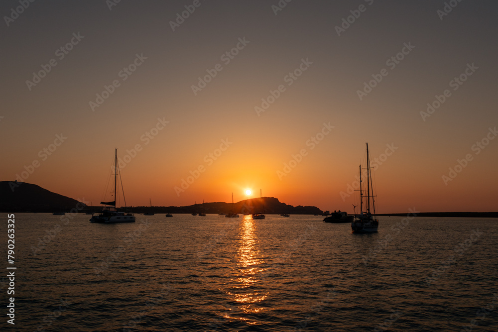 Yachts at anchor at Asinara Marine Park, Sardinia  at sunset