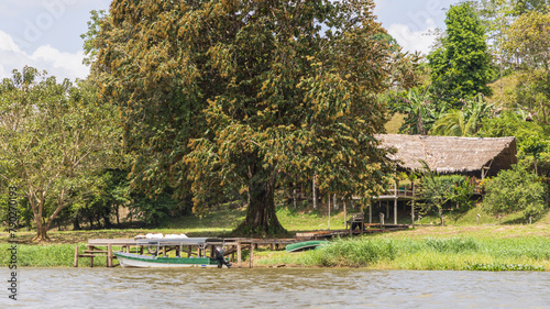 Scenic view of houses along San Juan river also known as El Desaguadero at the border of Costa Rica and Nicaragua photo