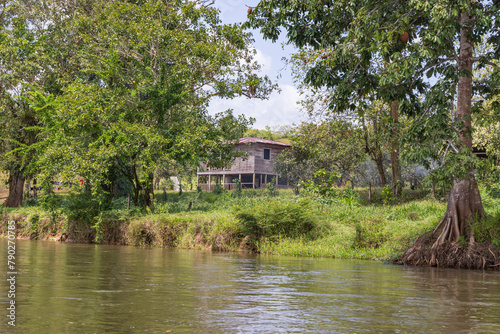 Scenic view of houses along San Juan river also known as El Desaguadero at the border of Costa Rica and Nicaragua photo