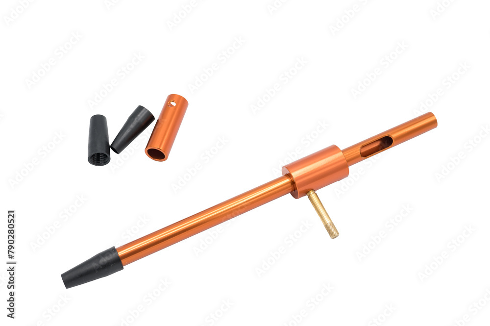 Detail of a universal guide for cleaning rifle and carbine barrels. It is an orange aluminum tube with interchangeable breech bolt lock and mouthpiece. It is on white background Detail of a universal guide for cleaning rifle and carbine barrels. It is an orange aluminum tube with interchangeable breech bolt lock and mouthpiece. It is on white background