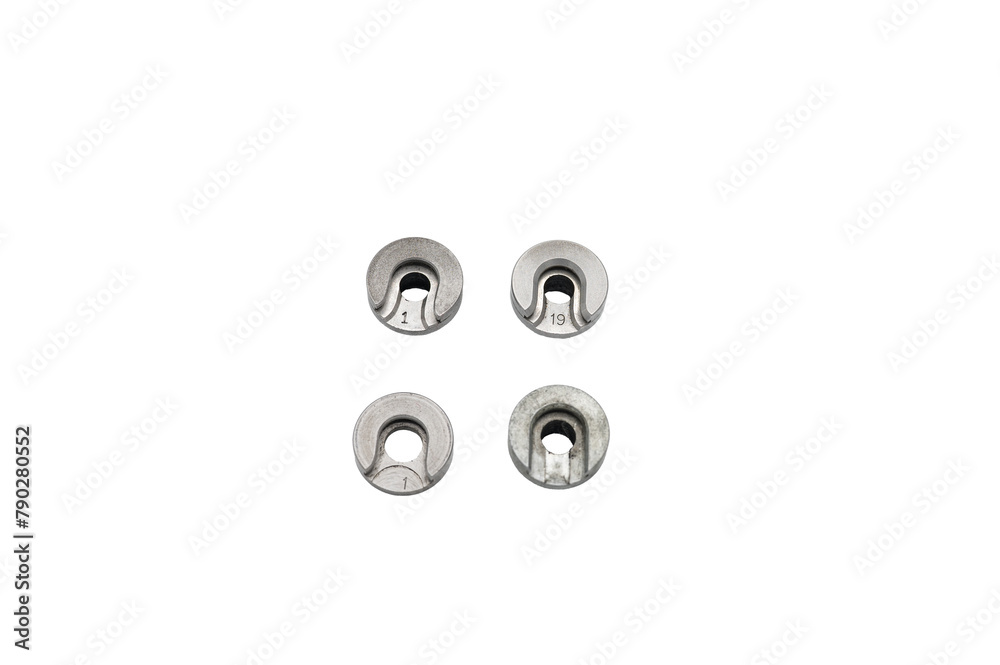 Detail of 4 shell holders for the reloading press, they are the supports that hold the pods to reload the metal ammunition. They are on a white background Detail of 4 shell holders for the reloading press, they are the supports that hold the pods to reload the metal ammunition. They are on a white background