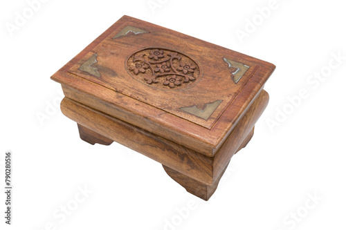 Detail of an old and beautiful handmade wooden box with decorations and metal inlays on a white background