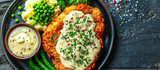 Chicken fried steak is a tenderized beef steak coated in seasoned flour, then fried until crispy and golden brown. It's often served with creamy gravy, mashed potatoes, and green beans