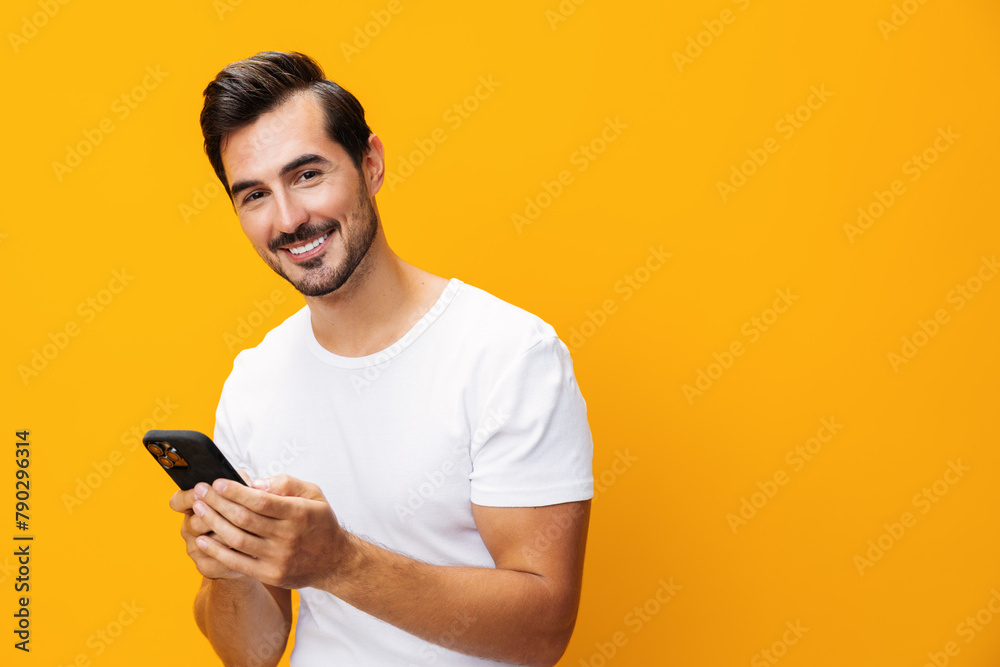 Phone man communication portrait copy smiling studio smartphone cyberspace space mobile happy yellow phone Phone man communication portrait copy smiling studio smartphone cyberspace space mobile happy yellow phone