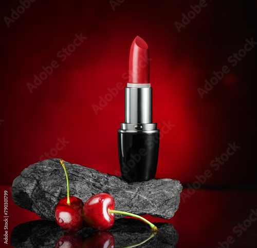 Red Lipstick over red background with cherry