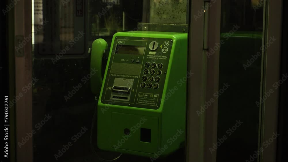 JAPAN - MARCH 2024 : View of PUBLIC PHONE BOX (Pay phone) at the street. JAPAN - MARCH 2024 : View of PUBLIC PHONE BOX (Pay phone) at the street.