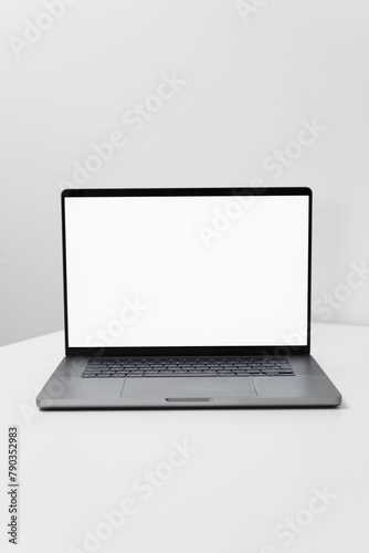 macbook laptop with white screen on a white table with white background, laptop screen mocap