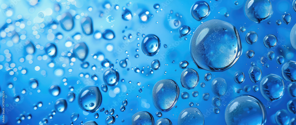 Macro shot of water droplets on a blue surface
