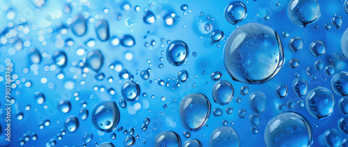 Macro shot of water droplets on a blue surface