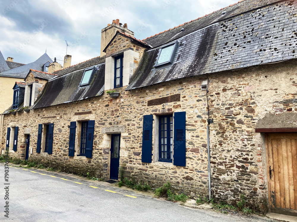 A well preserved old 17th century stone row house with slate roof on Rue du Plessis in the center of Redon, France. Part of the city’s rich architectural heritage as an important town in Brittany.