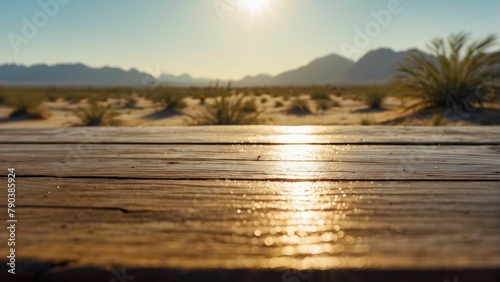 Sunset over desert landscape with wooden planks in foreground