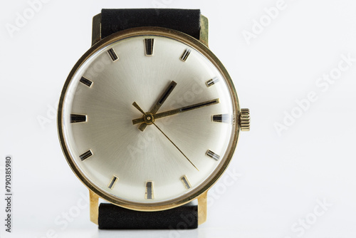 Timeless elegance, this handcrafted golden wristwatch from the 1960s exudes timeless sophistication, perfectly set against a white background.