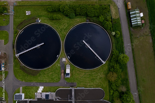 Circular sewerage water treatment containers facility in The Netherlands seen from above. Aerial sewer system and drink water filter infrastructure