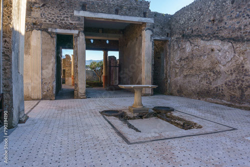 Interior view of ancient roman building Casa del Frutteto at the ruins of Pompeii, Campania, Italy