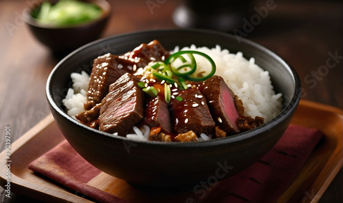 A plate of rice with pieces of beef meat and greens, on the kitchen table