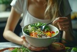 Fitness women eating a healthy poke bowl in the kitchen, fitness women eating, a healthy diet, healthy food, healthy salad, healthy food for diet, women fitness background