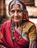 An elderly Indian lady dons a sari, celebrating the vibrant Holi festival.