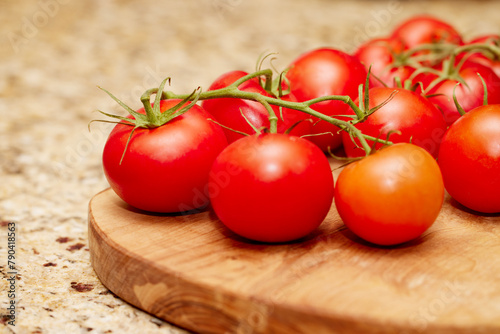 Organic red tomatoes on a vine