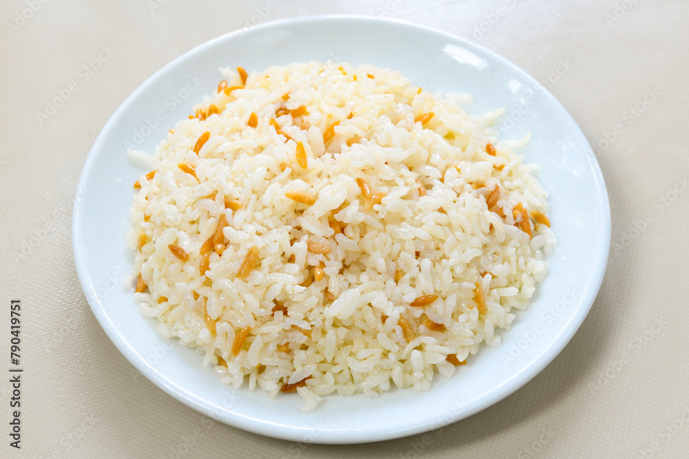 Traditional delicious Turkish food; Turkish style rice pilaf (Turkish name; Arpa sehriyeli. tavuklu, nohutlu, kavurmali, kuru fasulyeli, pirinc pilavi) Traditional delicious Turkish food; Turkish style rice pilaf (Turkish name; Arpa sehriyeli. tavuklu, nohutlu, kavurmali, kuru fasulyeli, pirinc pilavi)