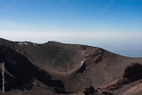 Silhouetted hikers summiting Mt Etna  Sicily 