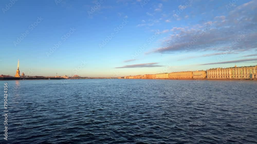 St. Petersburg, Russia - April 20, 2024. The University embankment of the Neva River. View of the sights of the city from the palace bridge. Panoramic view of the Neva River and the Palace embankment. St. Petersburg, Russia - April 20, 2024. The University embankment of the Neva River. View of the sights of the city from the palace bridge. Panoramic view of the Neva River and the Palace embankment.