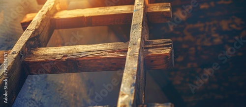 A sun shining through a wooden ladder