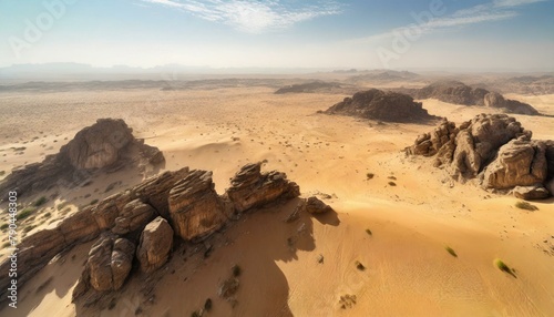 Top view, A vast desert expanse, its golden sands extending endlessly in all directions, interspersed with rocky formations and occasional oases.