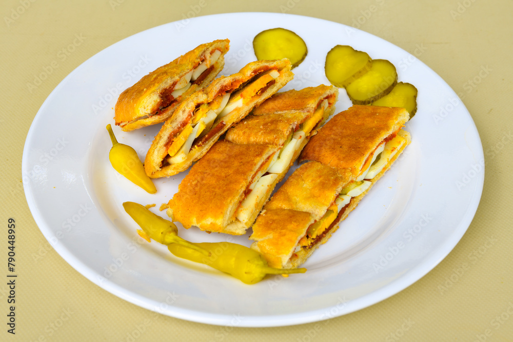Turkish karisik atom tost ( kasarli bazlama tost) . Sucuklu, Kasarli, kavurmali karisik tost. Flat baked bread toasted Turkish karisik atom tost ( kasarli bazlama tost) . Sucuklu, Kasarli, kavurmali karisik tost. Flat baked bread toasted