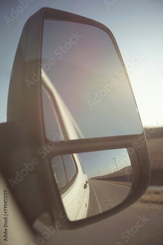 Car mirror. View to the road 