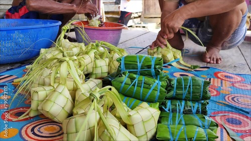 The process of making ketupat and buras, this is a typical Indonesian food which has become part of the people's culture during the Eid season. photo