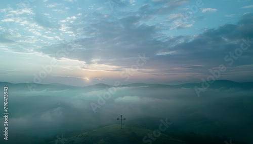 View of the Cross on the hill at sunlight, with a beautiful sea of ​​clouds