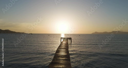 empty pier at Platja de Muro Mallorca at sunrise photo