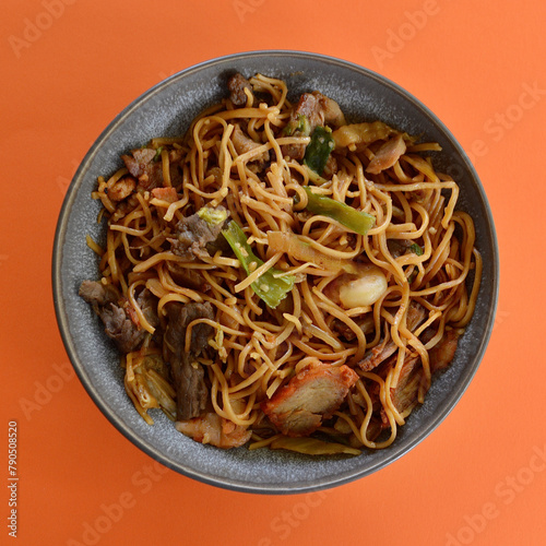 An Asian style stir fry combination with noodles.